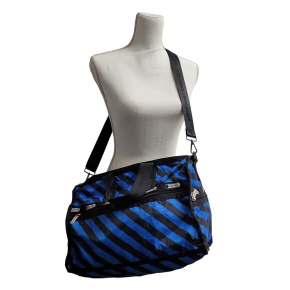 Lesportsac Handbags - Lesportsac large black and blue striped duffle bag traveler overnighter